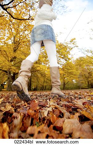 rear view of teenage girl running through park in autumn View Large Photo Image Stock Image - rear view of teenage girl running through park in autumn. Fotosearch