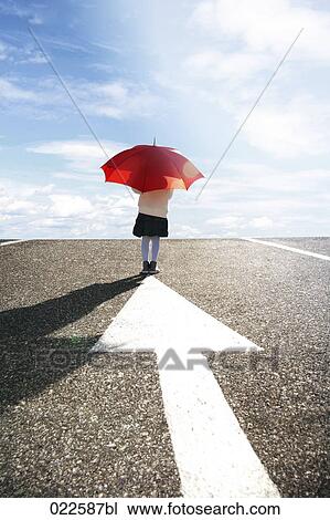 rear view of young girl with red umbrella standing on road View Large Photo Image Stock Image - rear view of young girl with red umbrella standing on road . Fotosearch