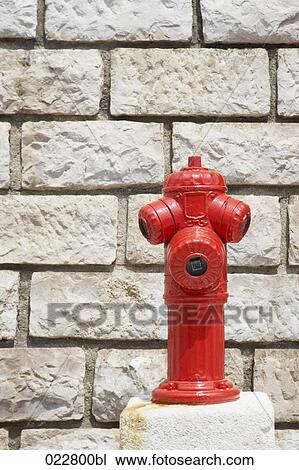 red fire hydrant in front of wall View Large Photo Image Stock Image - red fire hydrant in front of wall. Fotosearch