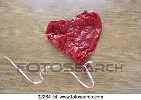 Stock Image - still life of cracked balloon. Fotosearch