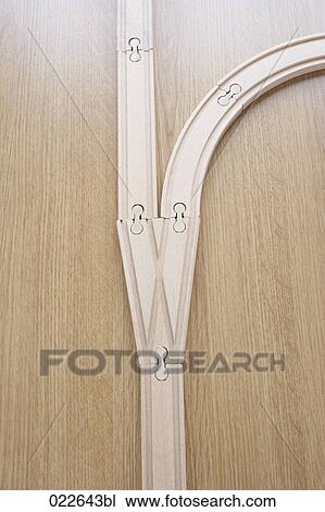 Stock Image - still life of wooden toy railway tracks with switch point. Fotosearch