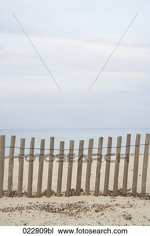 view at fence on empty beach near Saint Tropez in France View Large Photo Image Stock Image - view at fence on empty beach near Saint Tropez in France. Fotosearch