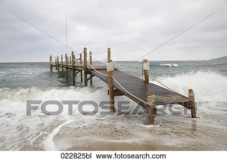 wooden pier near Saint Tropez during stormy weather View Large Photo Image Stock Image - wooden pier near Saint Tropez during stormy weather. Fotosearch