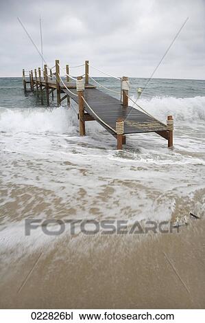 wooden pier near Saint Tropez during stormy weather View Large Photo Image Stock Image - wooden pier near Saint Tropez during stormy weather. Fotosearch