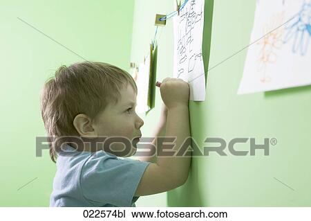 young boy making drawing View Large Photo Image Stock Image - young boy making drawing. Fotosearch
