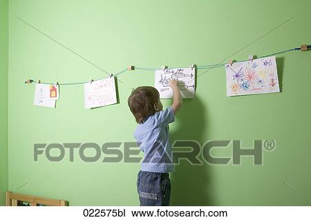 young boy making drawing View Large Photo Image Stock Image - young boy making drawing. Fotosearch