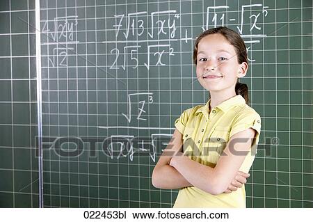 young girl in front of blackboard in classroom View Large Photo Image Stock Image - young girl in front of blackboard in classroom. Fotosearch