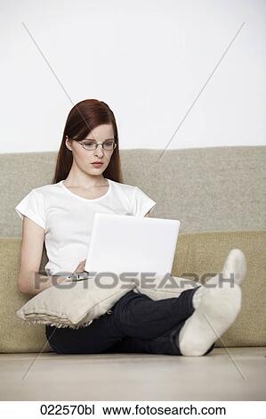 young woman sitting on floor reading book View Large Photo Image Stock Image - young woman sitting on floor reading book. Fotosearch