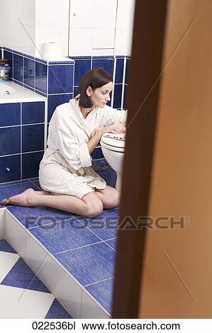young woman with laptop computer in bathroom View Large Photo Image Stock Image - young woman with laptop computer in bathroom. Fotosearch