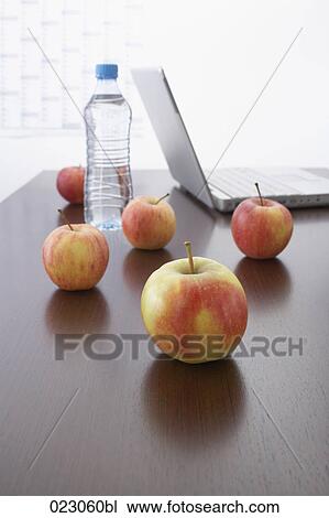apples water bottle and laptop computer on table View Large Photo Image Stock Image - apples water bottle and laptop computer on table. Fotosearch