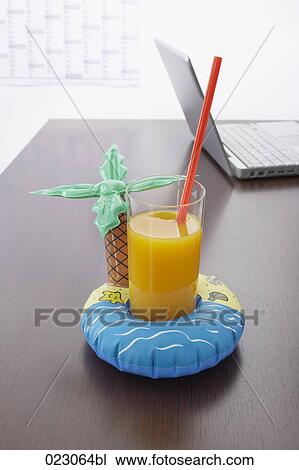 cocktail inflatable and laptop computer on table View Large Photo Image Stock Image - cocktail inflatable and laptop computer on table. Fotosearch
