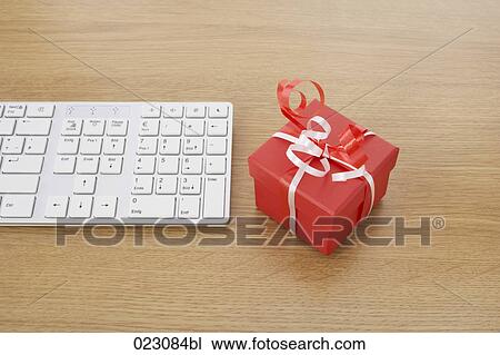 computer keyboard and present on table View Large Photo Image Stock Image - computer keyboard and present on table. Fotosearch