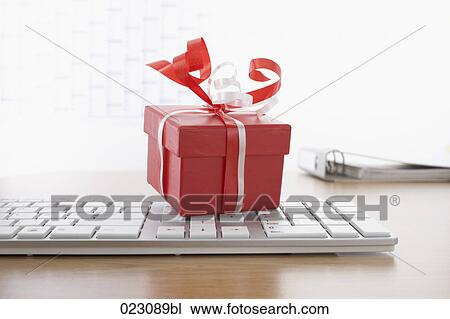 computer keyboard and present on table View Large Photo Image Stock Image - computer keyboard and present on table. Fotosearch