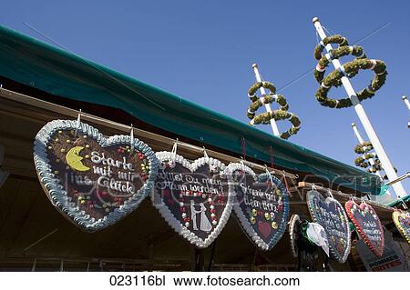 Stock Image - gingerbreads in shape of heart at the munich oktoberfest. Fotosearch