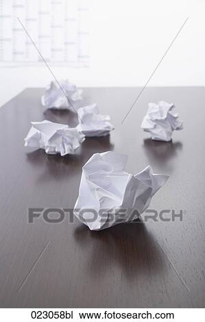 Stock Image - paper balls on table. Fotosearch