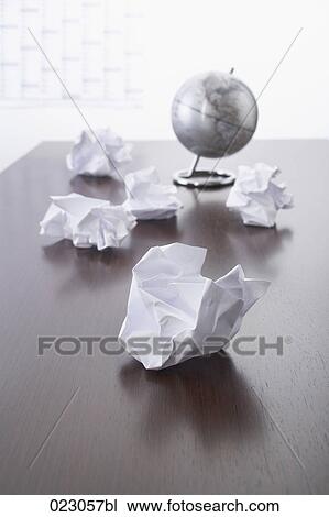 paper balls on table with globe in background View Large Photo Image Stock Image - paper balls on table with globe in background. Fotosearch