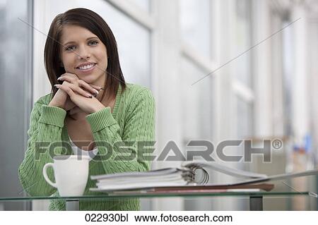 portait of young woman at desk View Large Photo Image Stock Image - portait of young woman at desk. Fotosearch