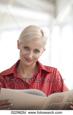 portrait of young blonde businesswoman reading document View Large Photo Image Stock Image - portrait of young blonde businesswoman reading document. Fotosearch