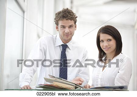 portrait of young businessman and businesswoman View Large Photo Image Stock Image - portrait of young businessman and businesswoman. Fotosearch
