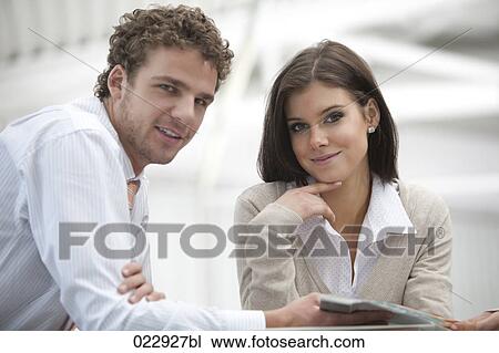 portrait of young businessman and businesswoman View Large Photo Image Stock Image - portrait of young businessman and businesswoman. Fotosearch