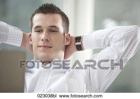 portrait of young businessman in front of computer View Large Photo Image Stock Image - portrait of young businessman in front of computer. Fotosearch
