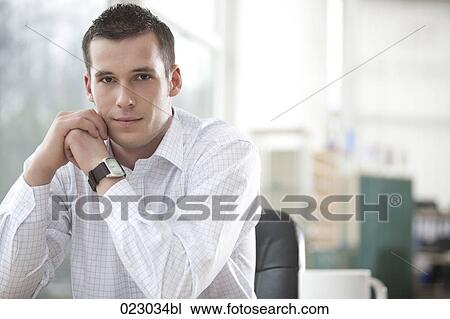 Stock Image - portrait of young businessman. Fotosearch