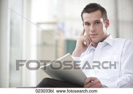 portrait of young businessman with document View Large Photo Image Stock Image - portrait of young businessman with document. Fotosearch