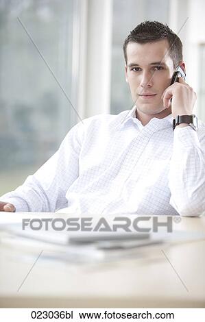 portrait of young businessman with mobile phone View Large Photo Image Stock Image - portrait of young businessman with mobile phone. Fotosearch