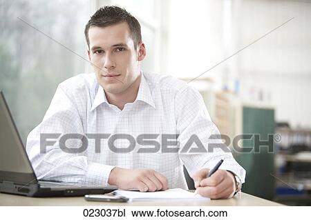 portrait of young businessman working with laptop computer View Large Photo Image Stock Image - portrait of young businessman working with laptop computer. Fotosearch