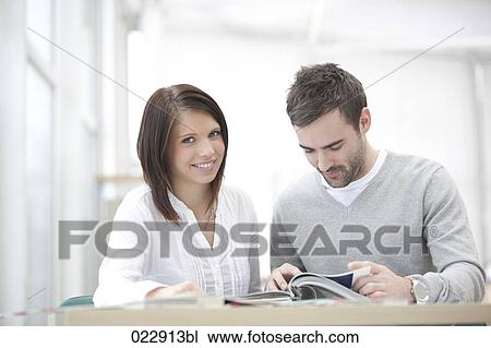 Stock Image - portrait of young businesswoman and businessman. Fotosearch
