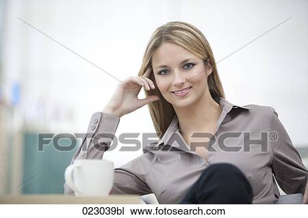portrait of young businesswoman having coffee break View Large Photo Image Stock Image - portrait of young businesswoman having coffee break. Fotosearch
