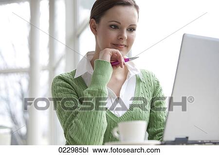portrait of young businesswoman working with laptop computer View Large Photo Image Stock Image - portrait of young businesswoman working with laptop computer. Fotosearch