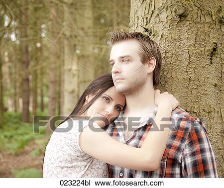 portrait of young couple in forest View Large Photo Image Stock Image - portrait of young couple in forest. Fotosearch