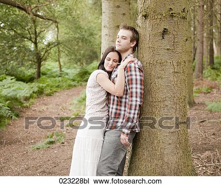 portrait of young couple in forest View Large Photo Image Stock Image - portrait of young couple in forest. Fotosearch