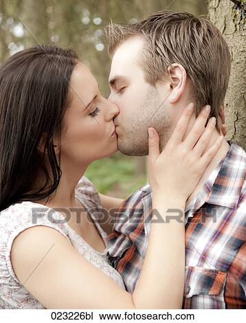 portrait of young couple kissing View Large Photo Image Stock Image - portrait of young couple kissing. Fotosearch
