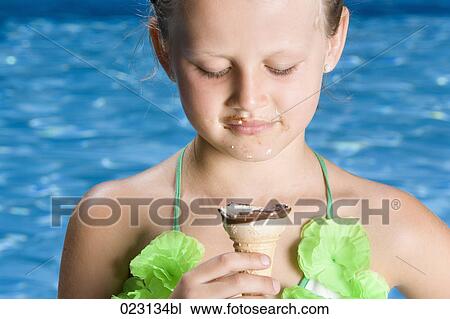 portrait of young girl eating ice cream in summer View Large Photo Image Stock Image - portrait of young girl eating ice cream in summer. Fotosearch