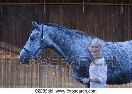 portrait of young girl holding white horse View Large Photo Image Stock Image - portrait of young girl holding white horse. Fotosearch