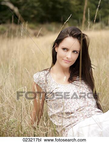 portrait of young woman in field View Large Photo Image Stock Image - portrait of young woman in field. Fotosearch