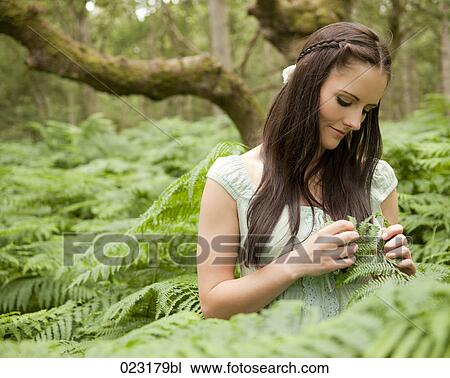 portrait of young woman in forest View Large Photo Image Stock Image - portrait of young woman in forest. Fotosearch
