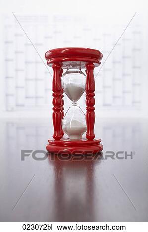red hourglass on table View Large Photo Image Stock Image - red hourglass on table. Fotosearch