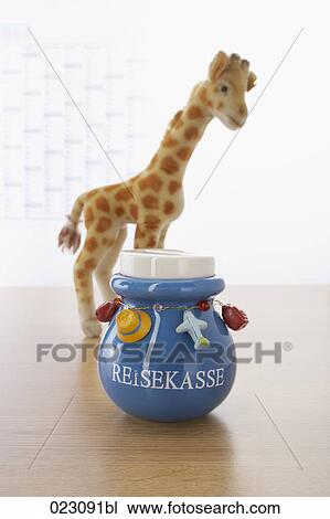 savings box for travel expenses on table View Large Photo Image Stock Image - savings box for travel expenses on table. Fotosearch