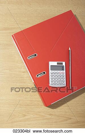 Stock Image - still life of file calculator and pencil. Fotosearch
