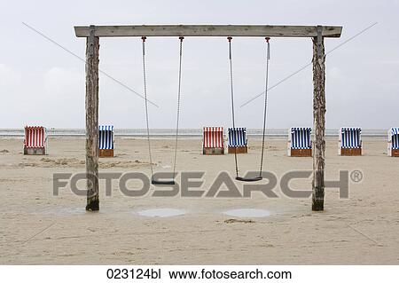 swings on empty beach View Large Photo Image Stock Image - swings on empty beach. Fotosearch