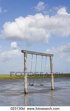 swings on empty beach View Large Photo Image Stock Image - swings on empty beach. Fotosearch