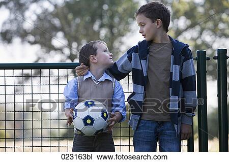 two young boys with football View Large Photo Image Stock Image - two young boys with football. Fotosearch