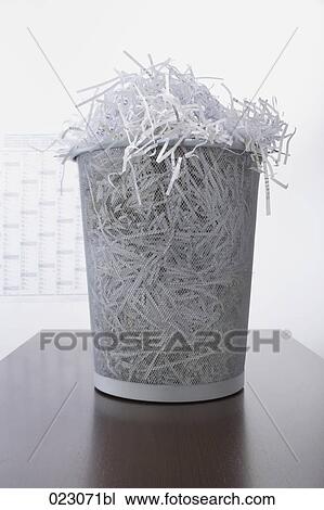 wastebasket full of shredded paper on table View Large Photo Image Stock Image - wastebasket full of shredded paper on table. Fotosearch
