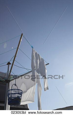 white clothes hanging on clothesline View Large Photo Image Stock Image - white clothes hanging on clothesline. Fotosearch