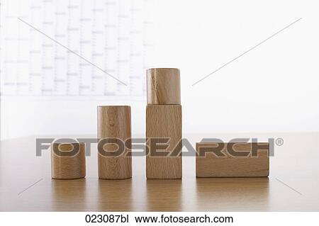 Stock Image - wooden pieces showing upward development. Fotosearch