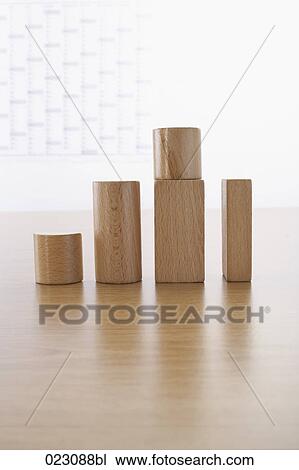 Stock Image - wooden pieces showing upward development. Fotosearch