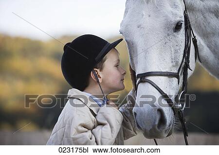 young boy and white horse View Large Photo Image Stock Image - young boy and white horse. Fotosearch